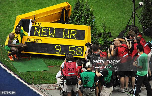 Jamaica's Usain Bolt celebrates winning the men's 100m final race of the 2009 IAAF Athletics World Championships ahead of US Tyson Gay on August 16,...