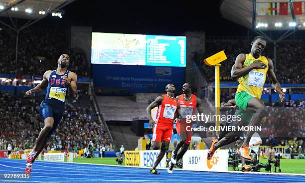 Jamaica's Usain Bolt wins the men's 100m final race of the 2009 IAAF Athletics World Championships ahead of US Tyson Gay and Jamaica's Asafa Powell...