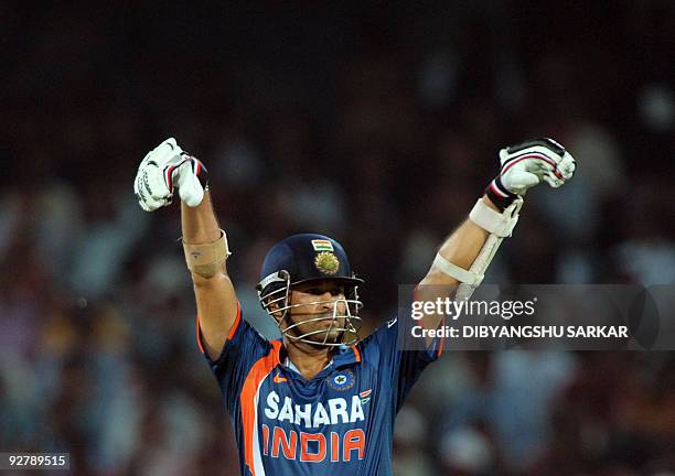 Indian cricketer Sachin Tendulkar gestures during the fifth One-Day International between India and Australia at the Rajiv Gandhi International...