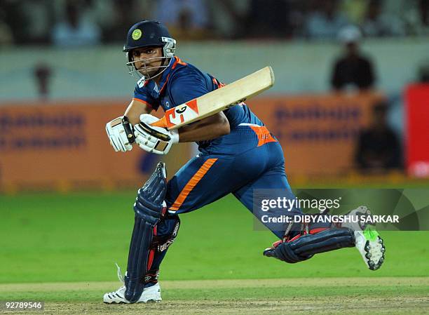 Indian cricketer Suresh Raina plays a shot during the fifth One-Day International between India and Australia at the Rajiv Gandhi International...