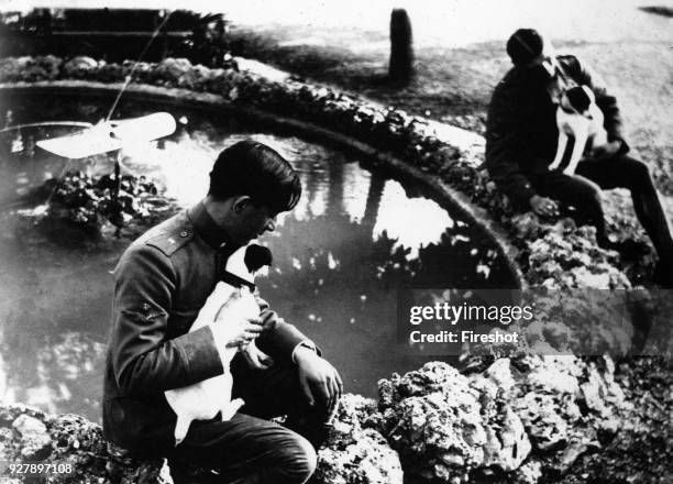 Aviators of the Great War. WWI. 1917. As luck would have it Contini and its mascot, in the foreground, are almost mirror to another aviator with his...