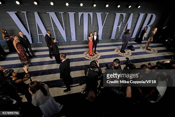 Allison Williams and Ricky Van Veen pose for pictures at the 2018 Vanity Fair Oscar Party hosted by Radhika Jones at Wallis Annenberg Center for the...