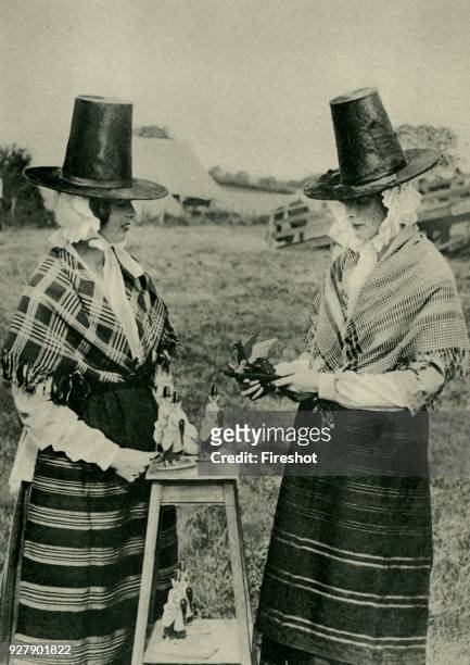 Wales. Two Welsh women participating in the Eisteddfod ceremonial at the little Flintshire town of Mold. 1920.