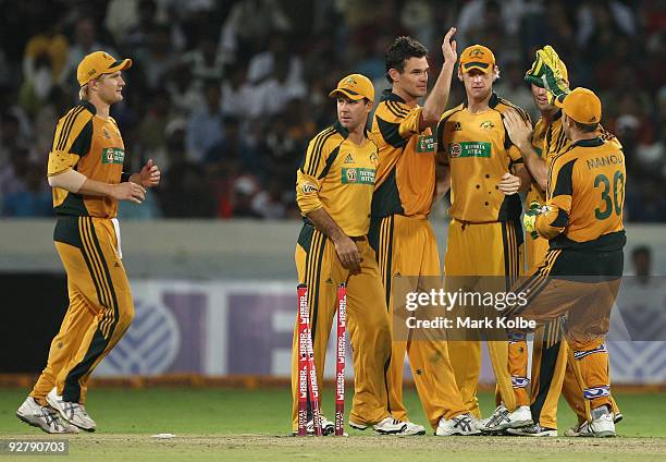 The Australian team celebrate the run-out of Ravindra Jadeja of India during the fifth One Day International match between India and Australia at...