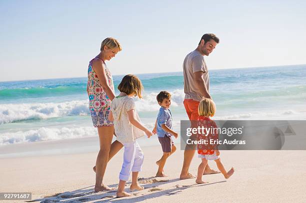 family walking on the beach - 2 year old blonde girl father stock pictures, royalty-free photos & images