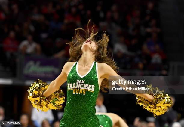 San Francisco Dons cheerleader performs during the team's semifinal game of the West Coast Conference basketball tournament against the Gonzaga...