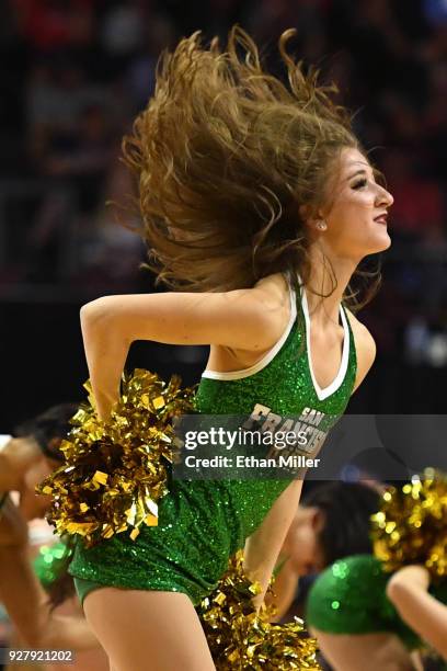 San Francisco Dons cheerleader performs during the team's semifinal game of the West Coast Conference basketball tournament against the Gonzaga...