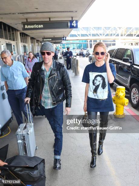 Kate Bosworth and Michael Polish are seen at Los Angeles International Airport on March 05, 2018 in Los Angeles, California.