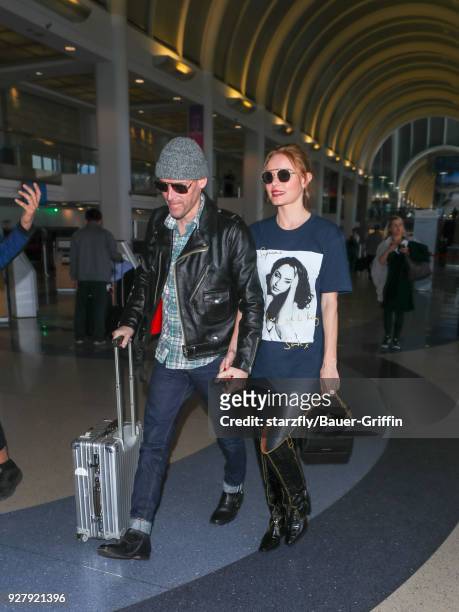 Kate Bosworth and Michael Polish are seen at Los Angeles International Airport on March 05, 2018 in Los Angeles, California.