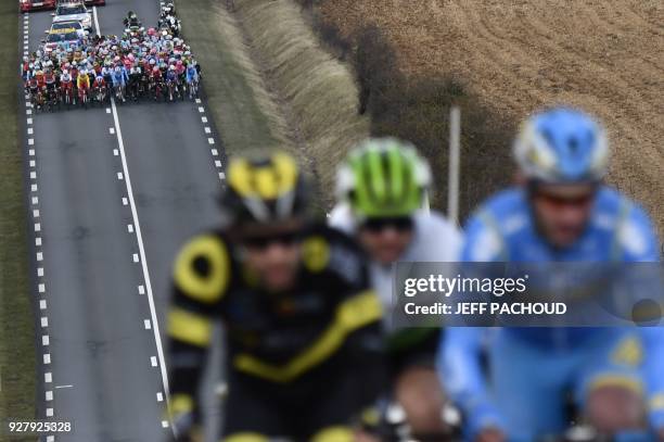 The pack rides in pursuit of a three-men breakaway Direct Energie French rider, Fabien Grellier, Dimension Data South African rider, Jay Thomson and...