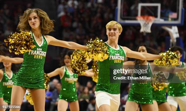 San Francisco Dons cheerleaders perform during the team's semifinal game of the West Coast Conference basketball tournament against the Gonzaga...