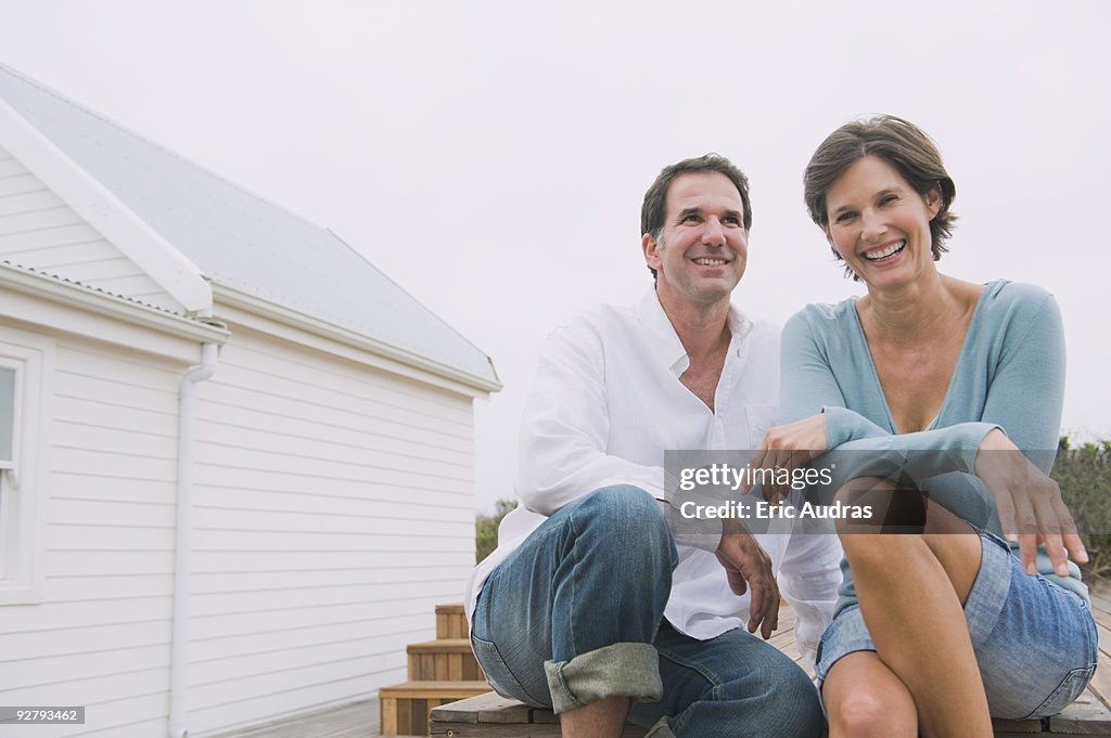 Couple sitting together and smiling