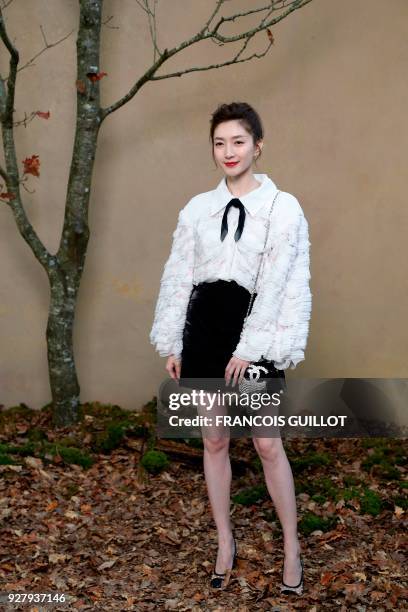 Chinese actress Maggie Jiang poses for a photo-call before the Chanel's 2018/2019 fall/winter collection fashion show on March 6, 2018 in Paris. /...