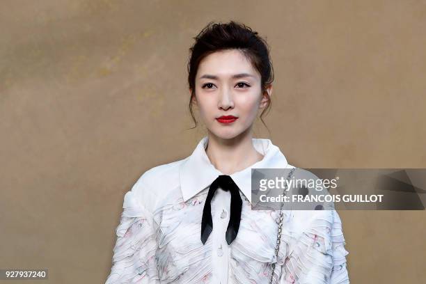 Chinese actress Maggie Jiang poses for a photo-call before the Chanel's 2018/2019 fall/winter collection fashion show on March 6, 2018 in Paris. /...