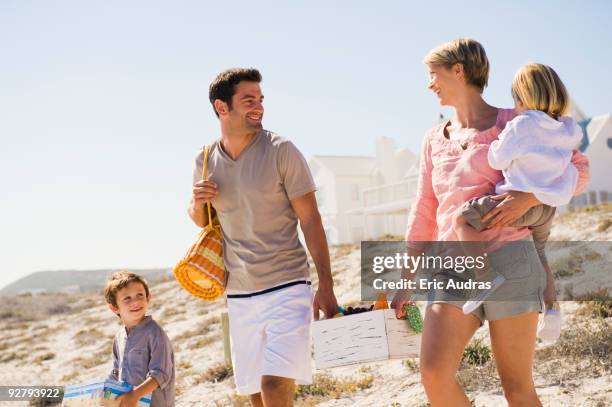 family on vacations on the beach - sandkiste stock-fotos und bilder