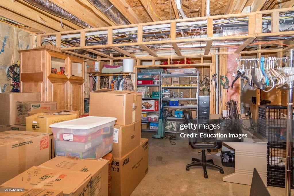Middle Class Basements Unfinished basement storage room interior of middle-class American ...