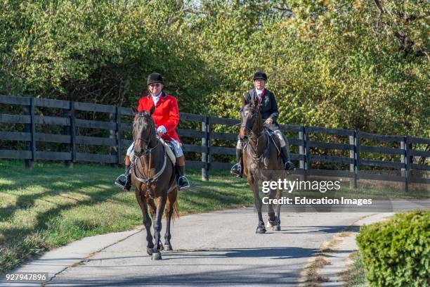 Two riders after the Annual Blessing of the Hounds at the Iroquois Hunt Club in Kentucky .