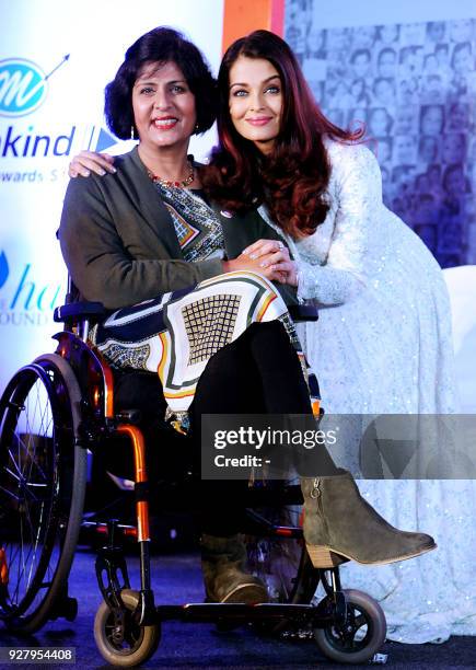 Indian Bollywood actress and and Smile Train Goodwill ambassador Aishwarya Rai Bachchan poses with Indian Olympic Paralympian athlete Deepa Malik...
