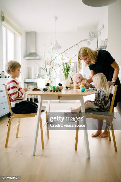 scandinavian family during easter preparation - family chalk drawing stock pictures, royalty-free photos & images