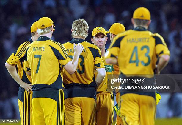 Australian cricket captain Ricky Ponting celebrates with teammates the wicket of Indian cricketer Harbhajan Singh , during the fifth One-Day...