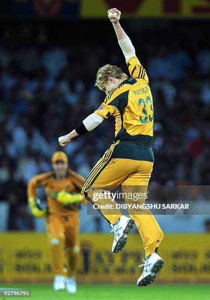 Australian cricketer Shane Watson celebrates the wicket of unseen Indian cricketer Yuvraj Singh, during the fifth One-Day International between India...