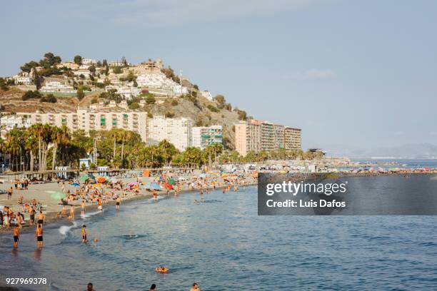 tourists on the beach in granada province - almuñecar stockfoto's en -beelden