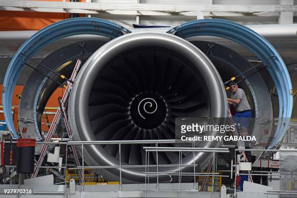 Picture taken in Blagnac, near Toulouse on March 6, 2018 shows a reactor of an A380 aircraft at the assembly site. / AFP PHOTO / REMY GABALDA