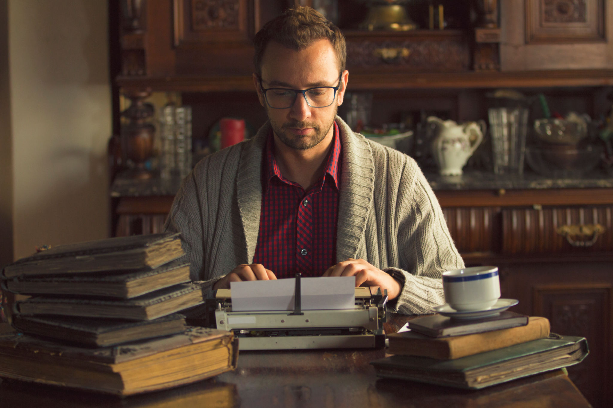 Young man writing on old typewriter. Young man writing on old typewriter.