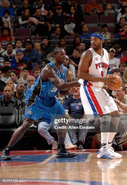 Chris Wilcox of the Detroit Pistons looks to maneuver against Brandon Bass of the Orlando Magic during the game on November 3, 2009 at The Palace of...
