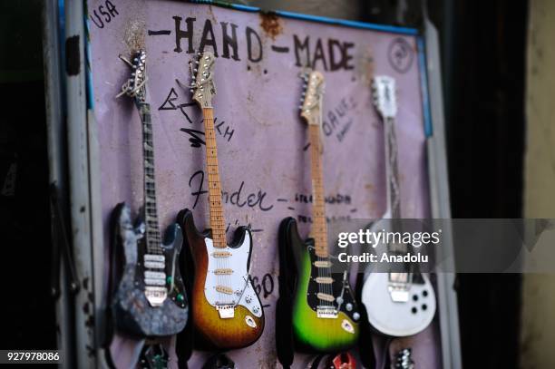 Hand made guitars are on sale at the Knez Mihailova Street in Belgrade, Serbia on March 04, 2018. The city has a different historical heritage and...