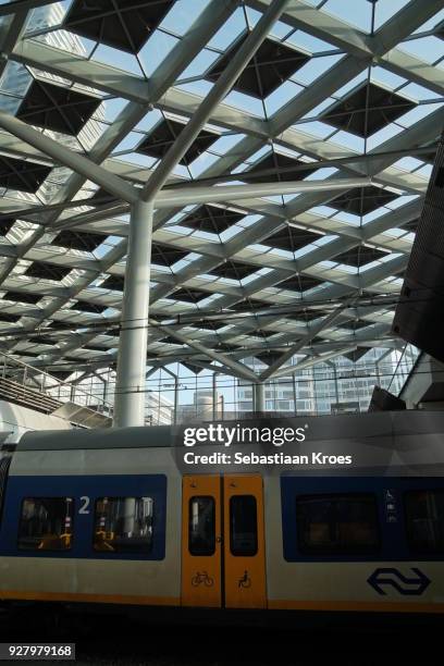 glass ceiling and train at den haag central station, the netherlands - 1973 2016 stock pictures, royalty-free photos & images