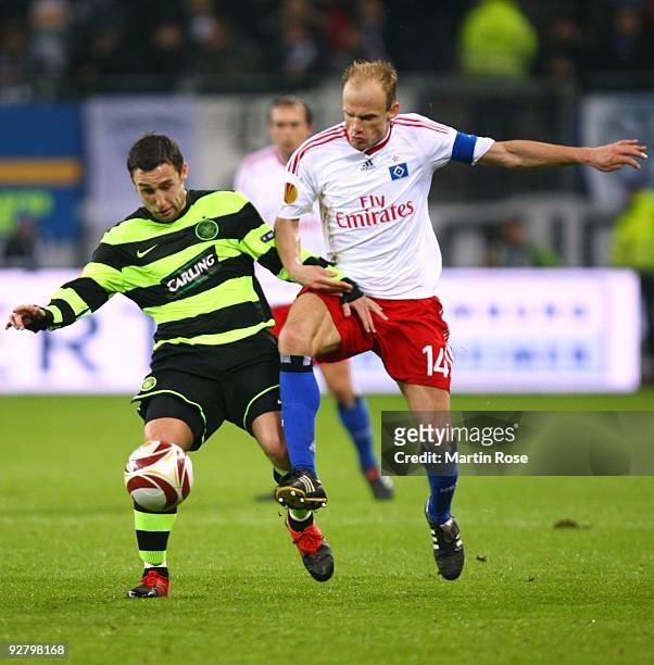 Scott McDonald of Celtic and David Jarolim of HSV battle for the ball during the UEFA Europa League Group C match between Hamburger SV and Cletic FC...