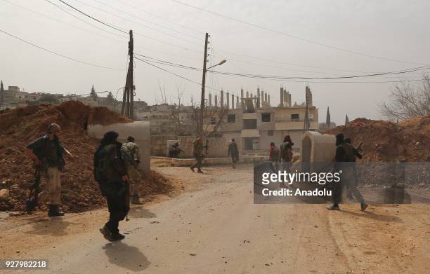 Members of Free Syrian Army , backed by Turkish Armed Forces patrol in the street after Turkish troops and the FSA liberated three more villages...