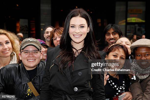 Actress Bridget Regan poses with fans at the "Legend of The Seeker" The Sword of Truth unveiling at Military Island, Times Square on November 5, 2009...