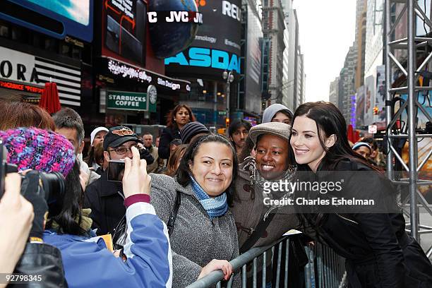 Actress Bridget Regan poses with fans during the "Legend of The Seeker" The Sword of Truth unveiling at Military Island, Times Square on November 5,...