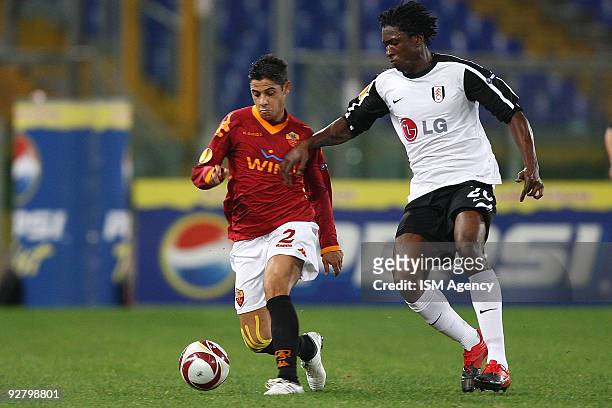 Dickson Etuhu of Fulham and Cicinho of AS Roma competes for the ball during the UEFA Europa League group E match between AS Roma and Fulham at...