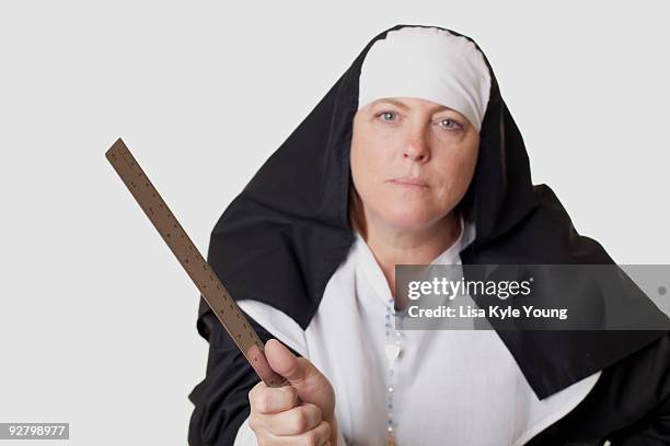 nun ready to smack you with ruler - bad habit fotografías e imágenes de stock