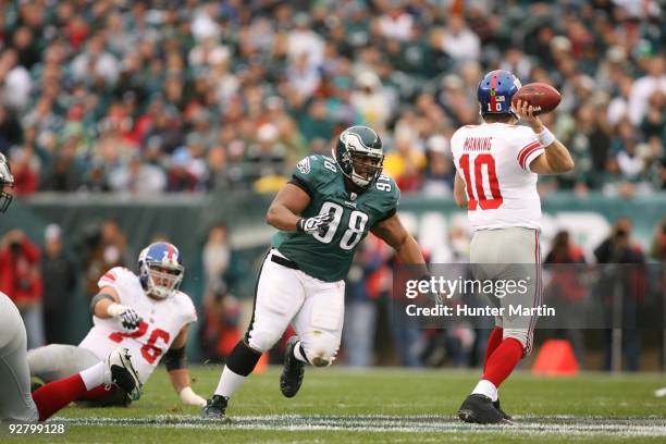 Defensive tackle Mike Patterson of the Philadelphia Eagles rushes quarterback Eli Manning of the New York Giants during a game on November 1, 2009 at...