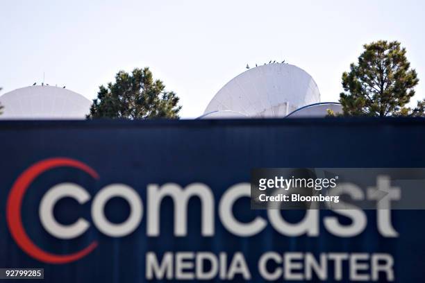 Satellite dishes are visible at the Comcast Media Center in Centennial, Colorado, U.S., on Wednesday, Nov. 4, 2009. Comcast Corp., the largest U.S....