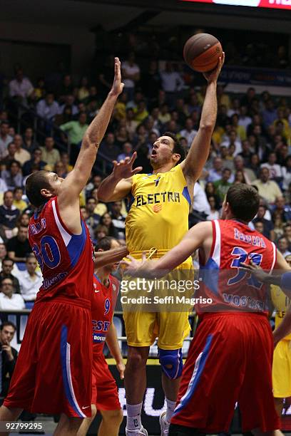 Yaniv Green of Maccabi Electra competes with Dmitry Sokolov of CSKA Moscow and Viktor Khryapa of CSKA Moscow in action during the Euroleague...