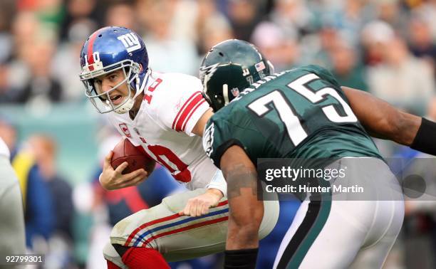 Defensive end Juqua Parker of the Philadelphia Eagles rushes quarterback Eli Manning of the New York Giants during a game on November 1, 2009 at...