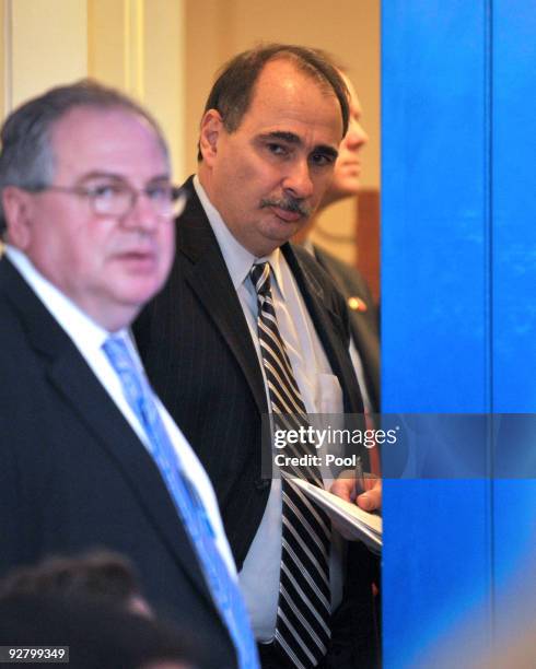 White House Senior Adviser David Axelrod looks on as U.S. President Barack Obama arrives for a statement in the Brady Briefing Room of the White...