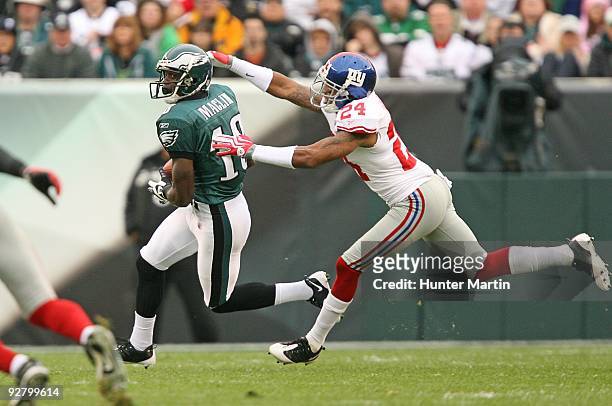 Wide receiver Jeremy Maclin of the Philadelphia Eagles tries to avoid the tackle of cornerback Terrell Thomas of the New York Giants during a game on...