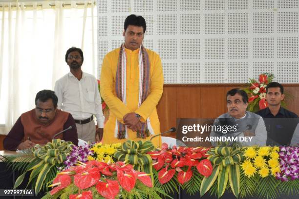 Bharatiya Janata Party Tripura state president and chief minister designate Biplab Kumar Deb speaks as BJP leader Nitin Gadkari looks on during a...