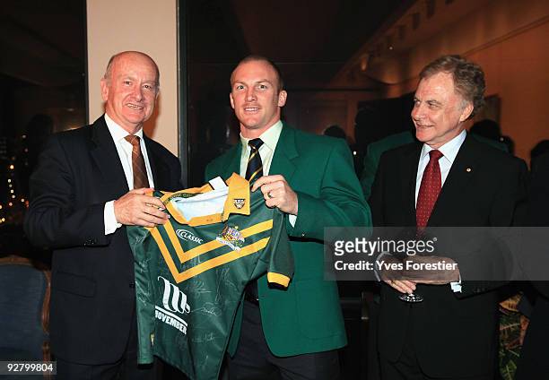 Australian Ambassador of France David Ritchie, Captain of Australian rugby league team Darren Lockyer and ARL Chairman Colin Love pose as they attend...
