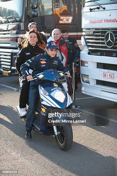 Dani Pedrosa of Spain and Repsol Honda Team rides a scooter in paddock during the last round of Comunitat Valenciana Grand Prix MotoGP in the...