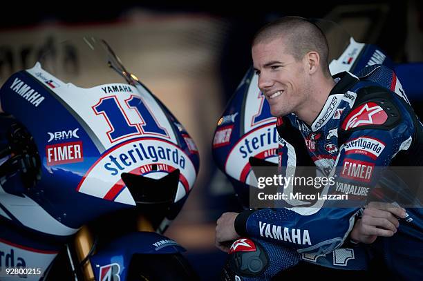 Ben Spies of USA and Yamaha Factory Racing smiles and poses with his new bike in box during the pit walk of last round of Comunitat Valenciana Grand...