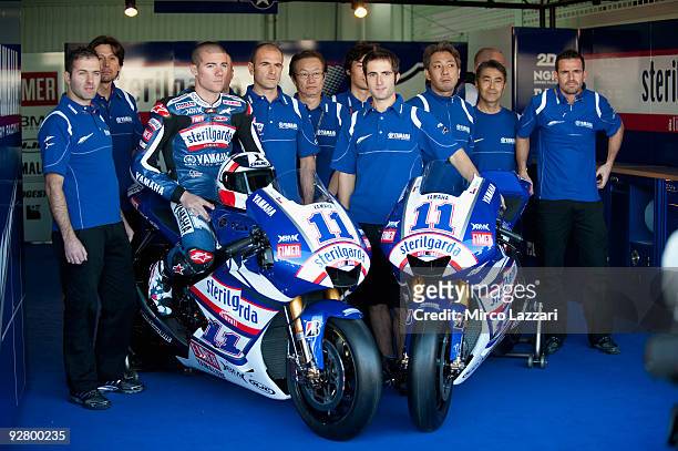 Ben Spies of USA and Yamaha Factory Racing poses with his new bike and team in box during the last round of Comunitat Valenciana Grand Prix MotoGP in...