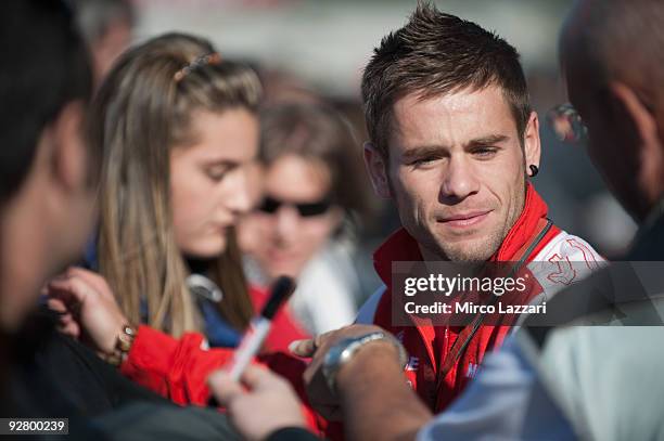 Alvaro Bautista of Spain and Mapfre Aspar Team signs autographs for fans during the event "Riders for Health" of last round of Comunitat Valenciana...