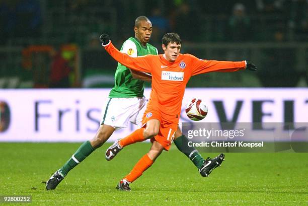 Naldo of Bremen and Zlatko Junuzovic of Austria battle for the ball during the UEFA Europa League Group L match between Werder Bremen and Austria...
